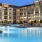 a large building with a pool