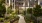 a courtyard with trees and plants in front of a building